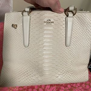 Coach Python carryall in the Chalk color.